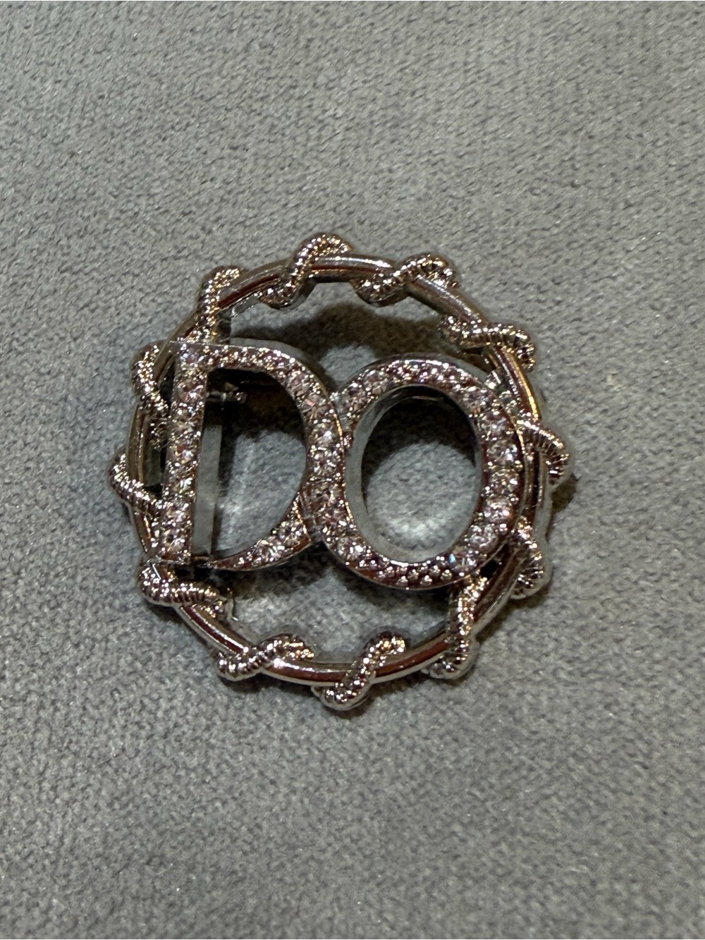 Crystal 'DO' Logo Brooch in Silver Tone